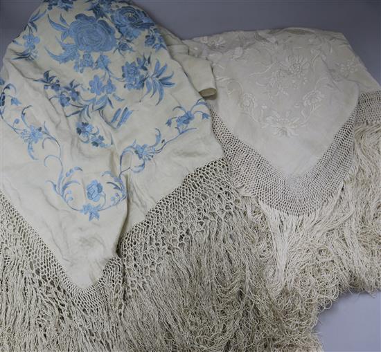 A Chinese embroidered shawl and another pale blue on cream embroidered shawl